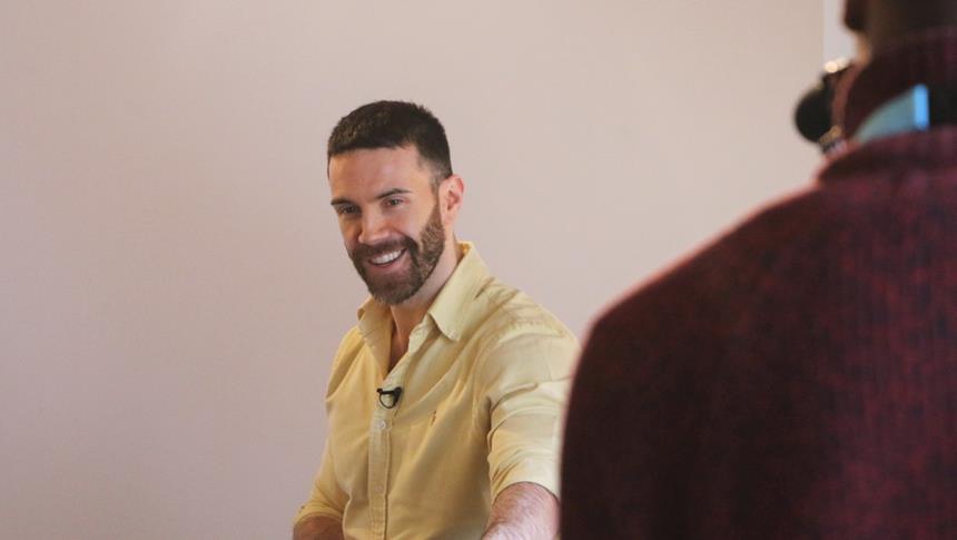 a man in yellow shirt