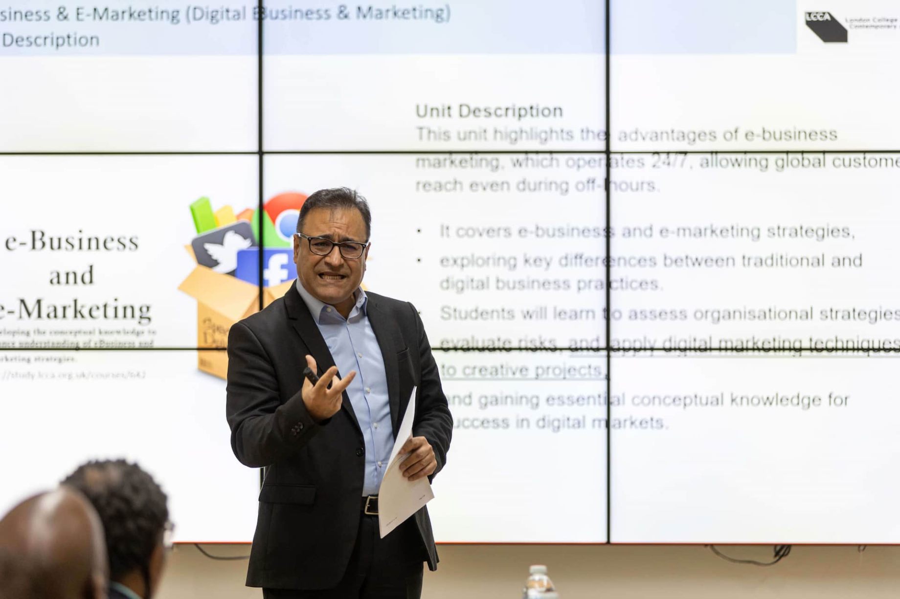 A person presenting a lecture to students