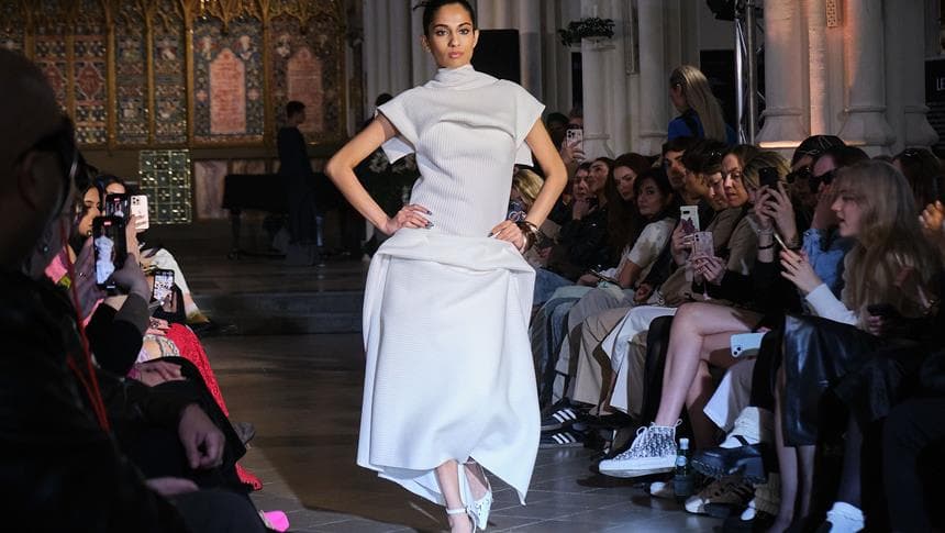 a model doing a catwalk at a fashion show
