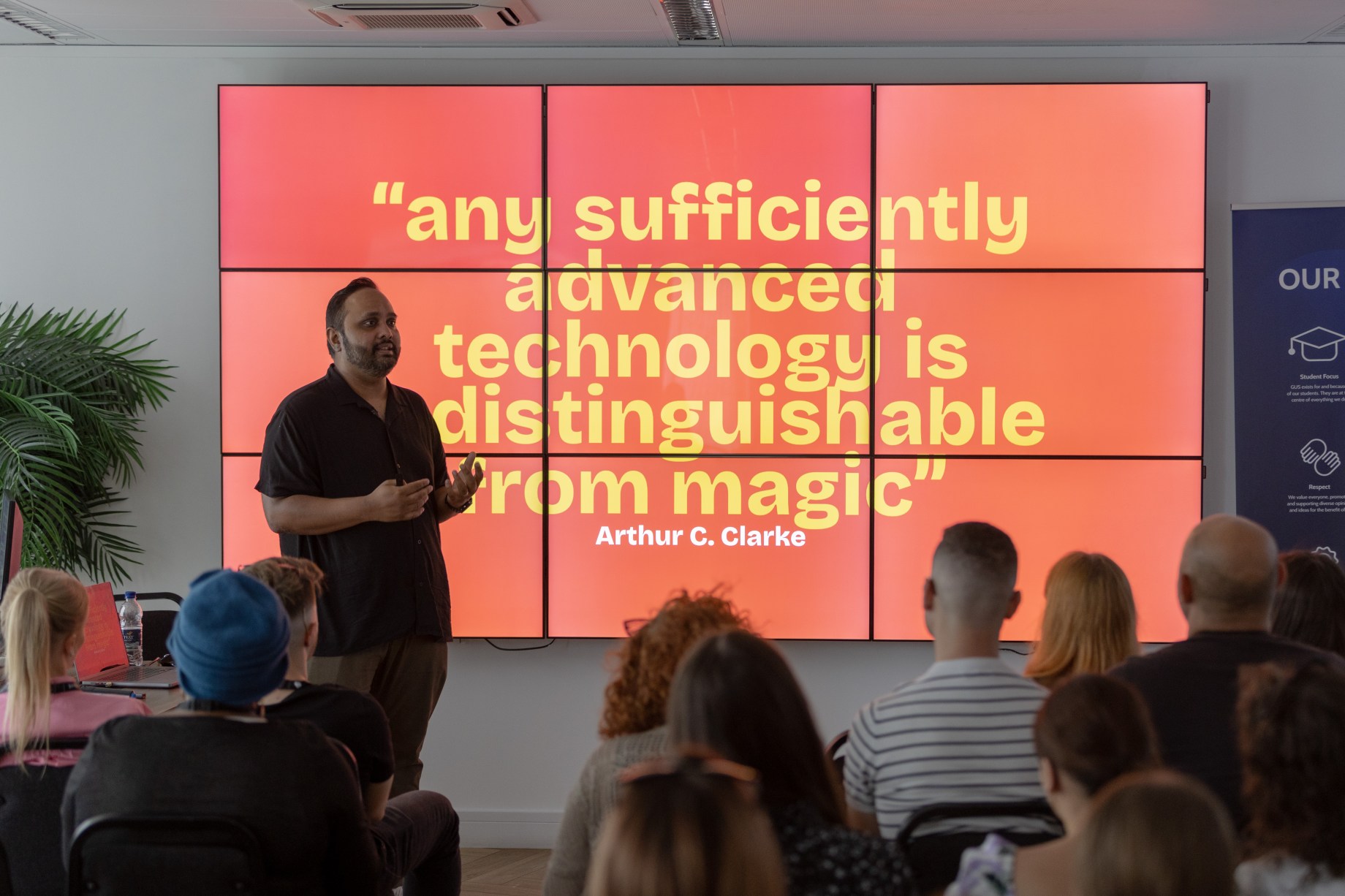 a man presenting to a group of people