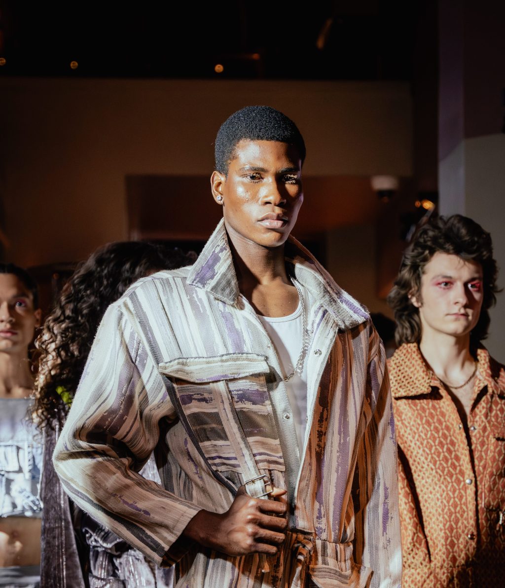 Male model in catwalk show