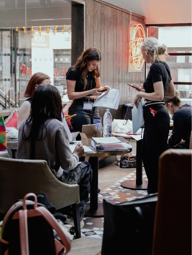 Fashion Management and Marketing Students in a behind the scenes shot of a fashion show