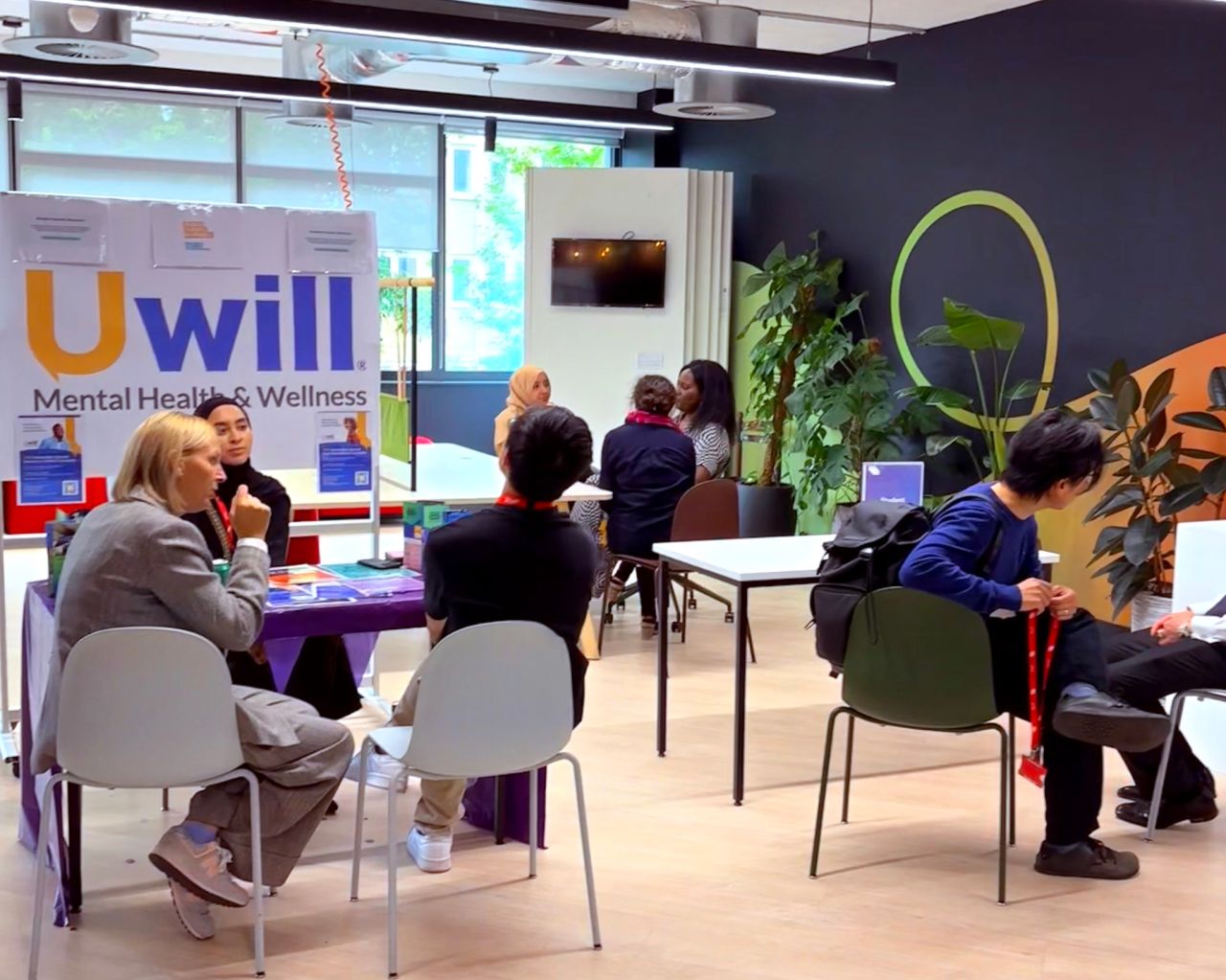 mental health awareness event, people sitting around tables