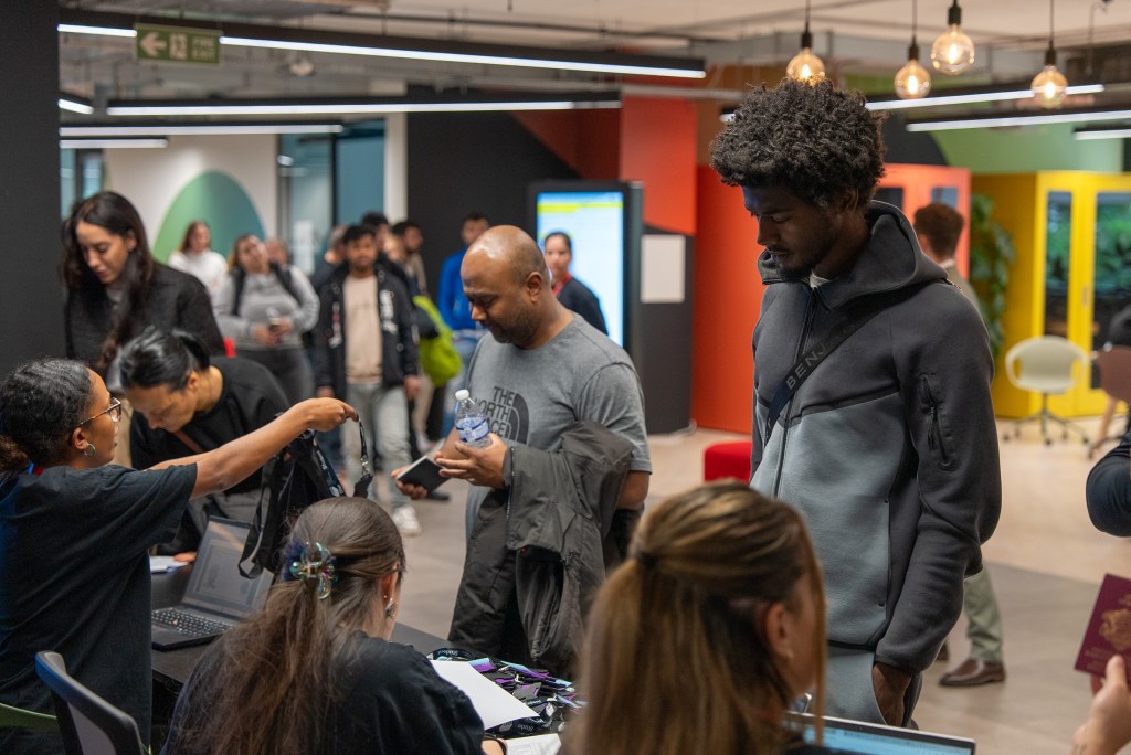 new students on LCCA campus queuing at the reception for registration