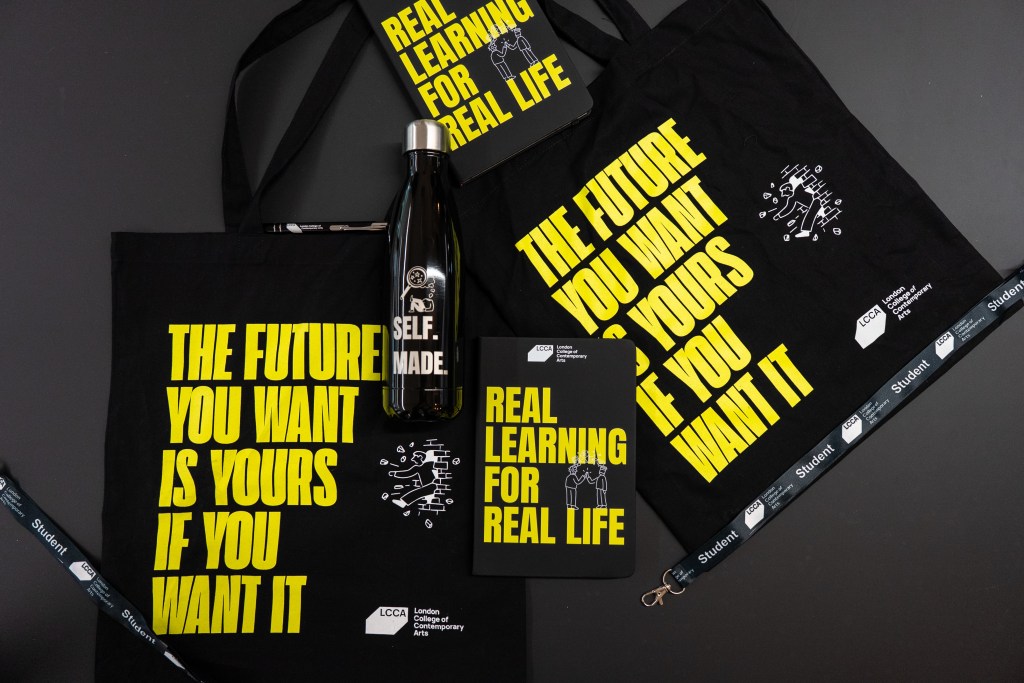 a product shoot of the new LCCA merch: totebag, lanyards, waterbottle, notepad, pens