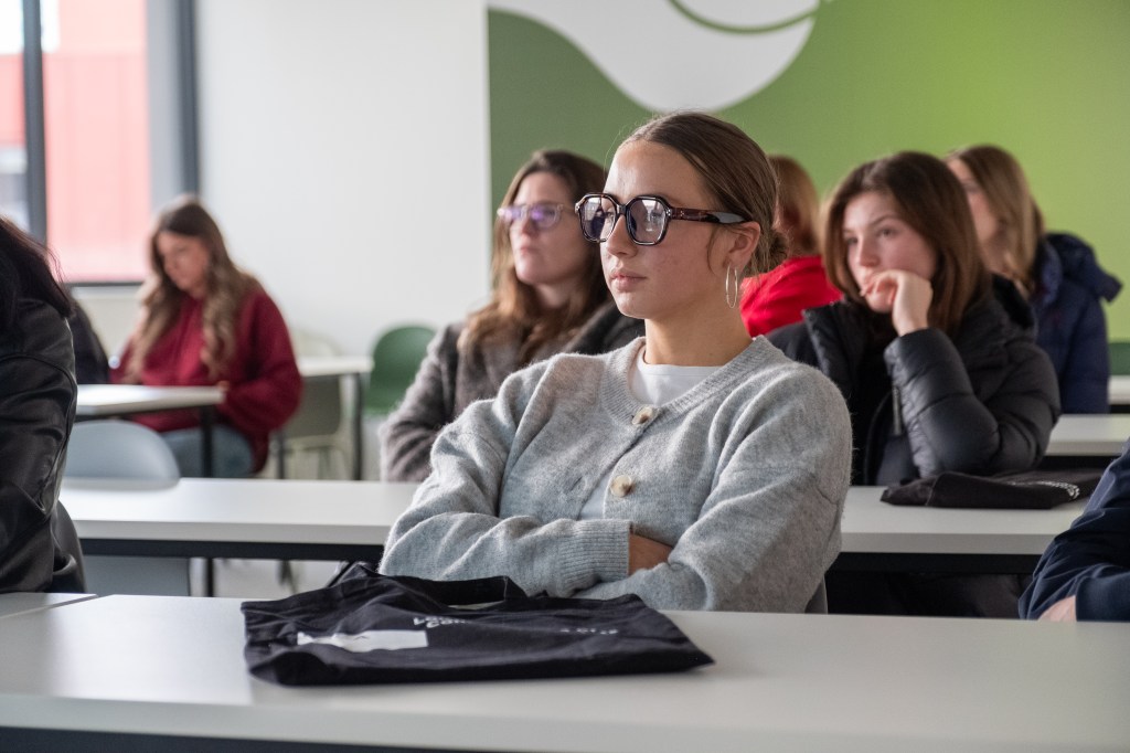 a classroom with people in classroom