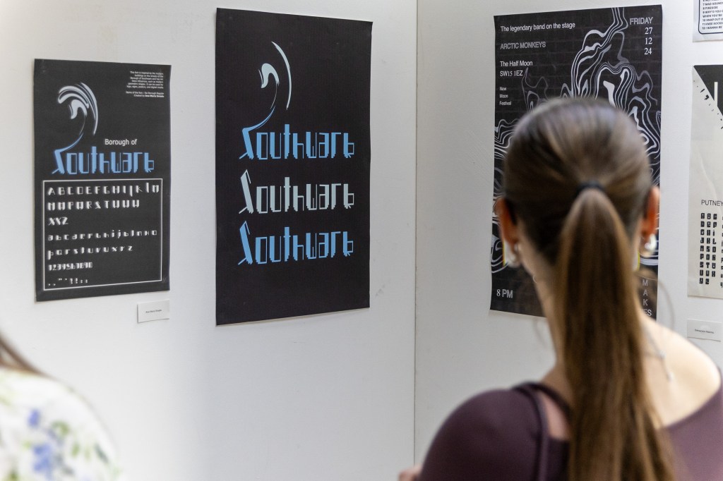 Someone looking at graphic design work