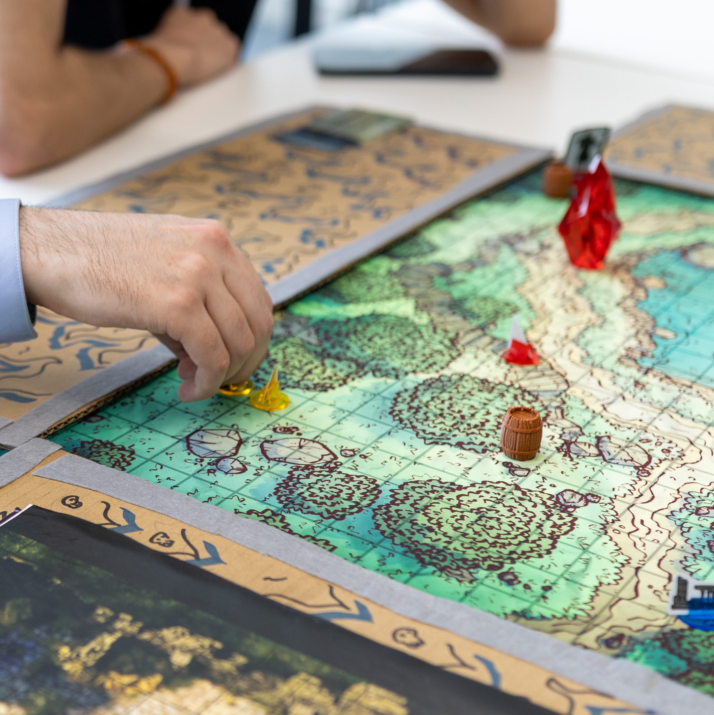 Student playing a board game that looks like a map
