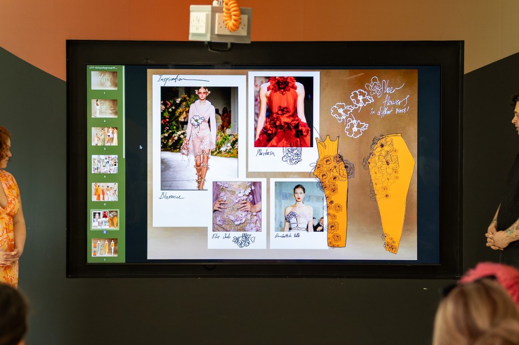 A screen with fashion students design work