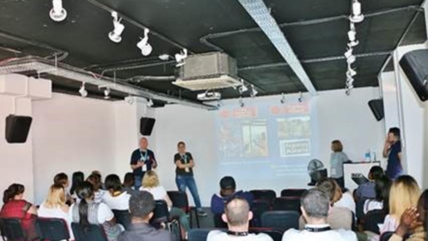 people in a class watching a presentation