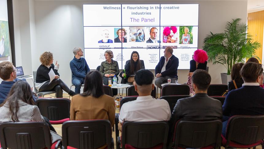 a panel of people talking to an audience