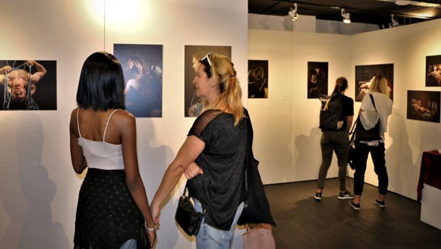 People looking at photography exhibition