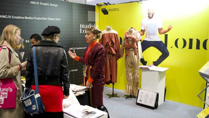 Sadie Clayton at the LCCA stand at UCAS fair talking to prospective students