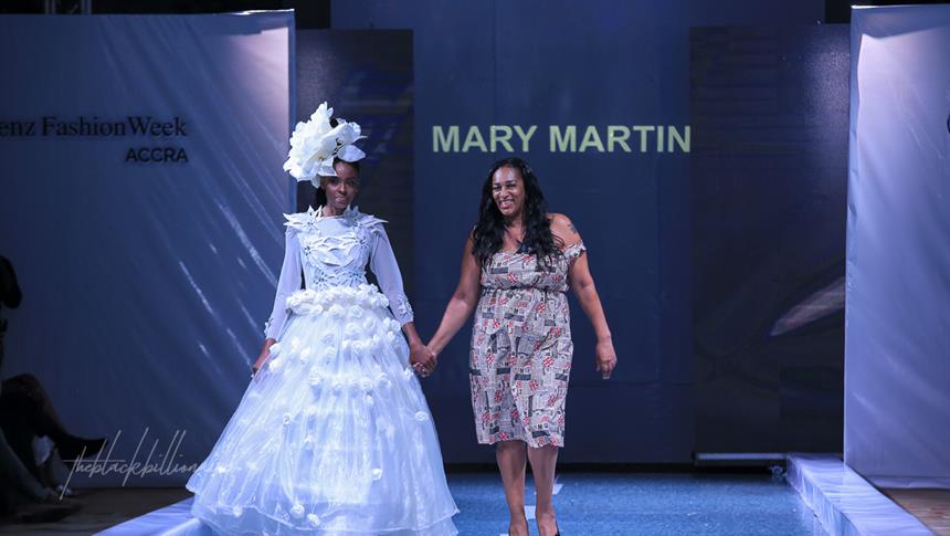 2 people walking at a fashion show