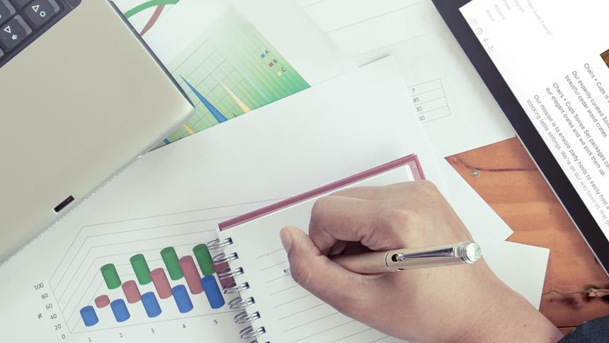 person writing on a notepad