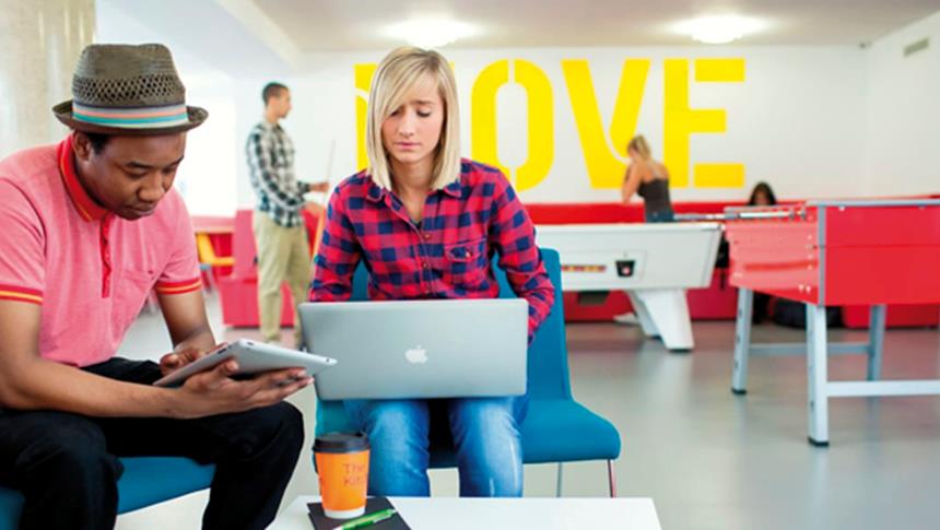 2 people looking at a laptop