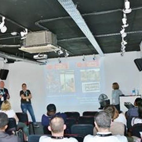 people in a class watching a presentation