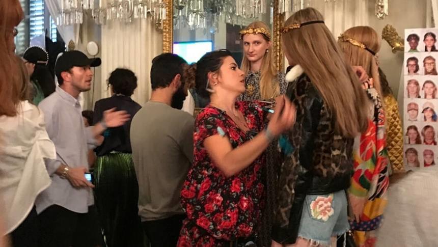 people at a backstage fashion show event