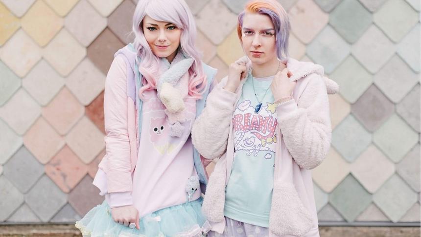 a people in pastel clothes