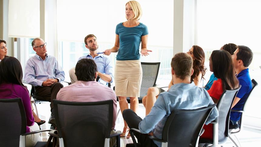 a women talking to a group of people